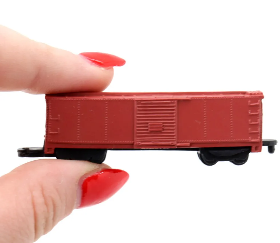 10 Figurines trains à vapeur dans un tube de rangement